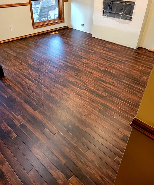 Living room with dark reddish-brown plank flooring